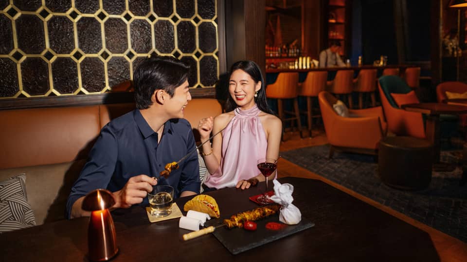 Man and woman enjoying a meal in Harbour Bar