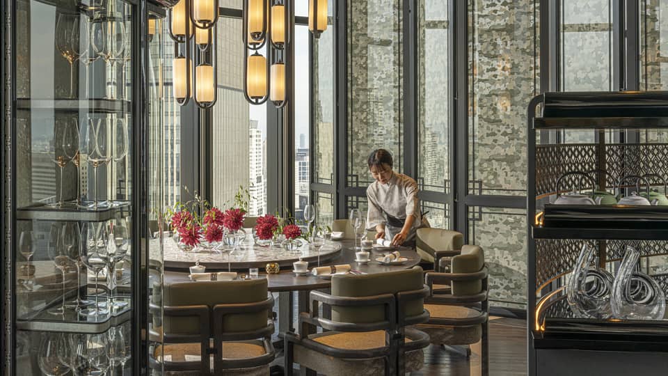 Light-filled dining area inside Jiang Nan Chun restaurant at Four Seasons Hotel Osaka