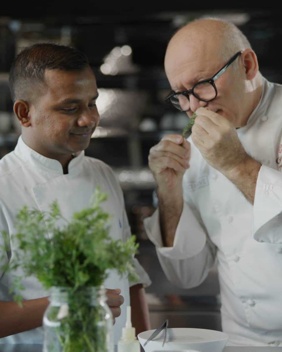 Chef Gaetano Trovato and his apprentice in the kitchen at Blu Beach Club
