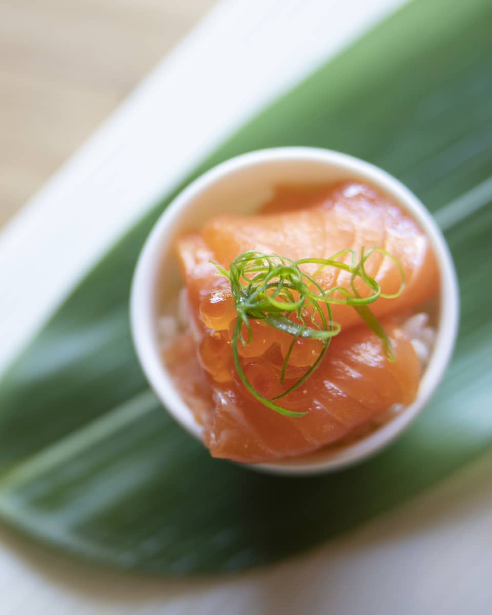 Fresh salmon plated on a banana leaf