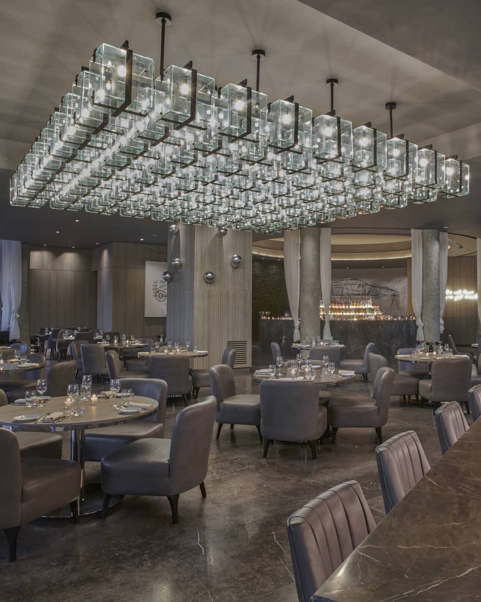 Bullona dining area and seafood counter with low lighting and marbled floors