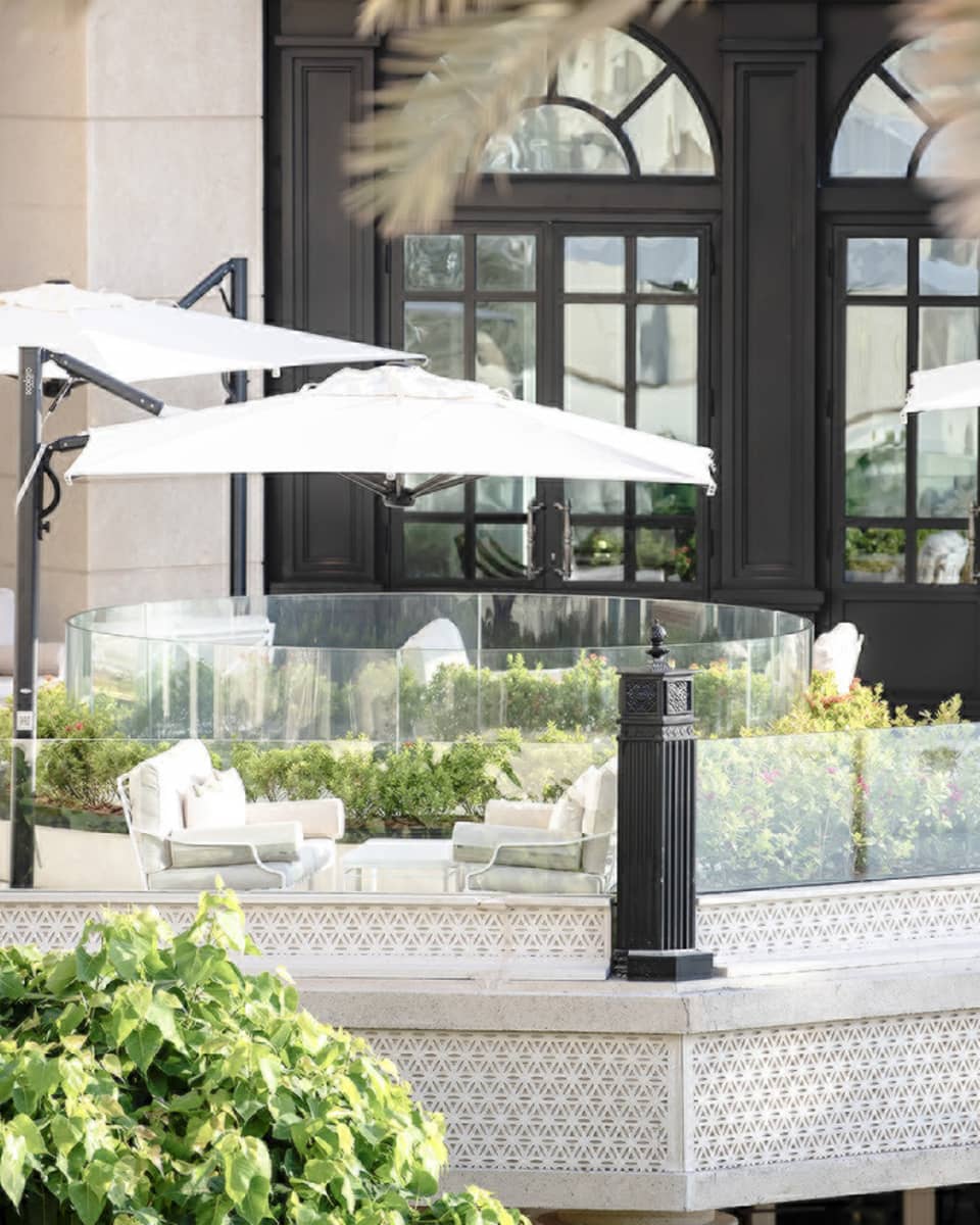 Seasons Tea Lounge patio lounge sofas under white umbrellas