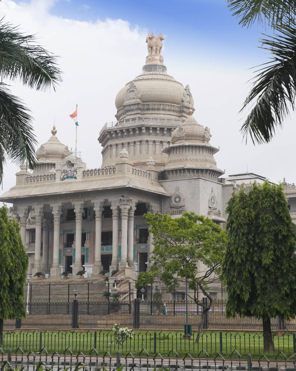 Palm trees in front of Vidhana Soudha government building exterior