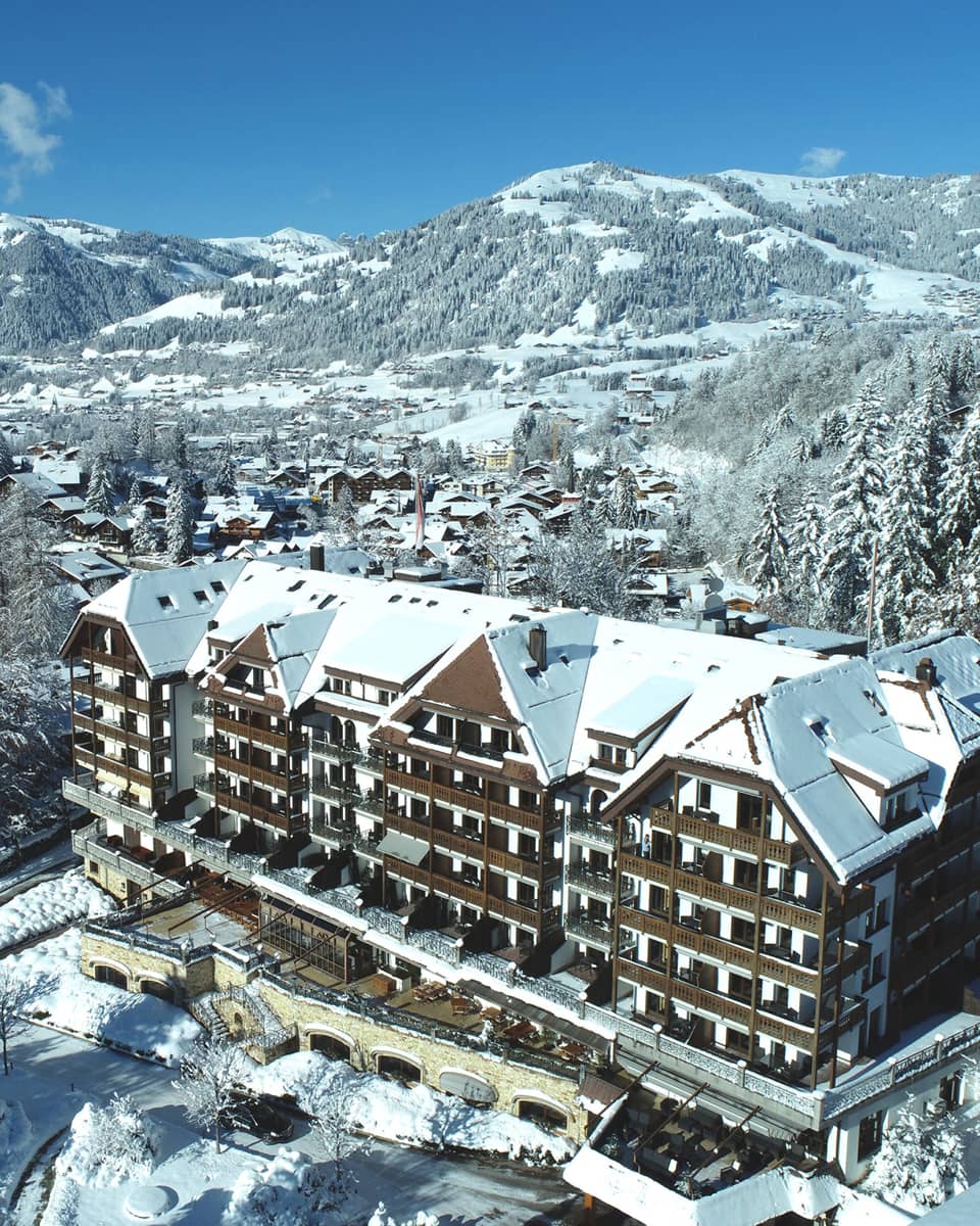 Aerial rendering of resort with mountains in background