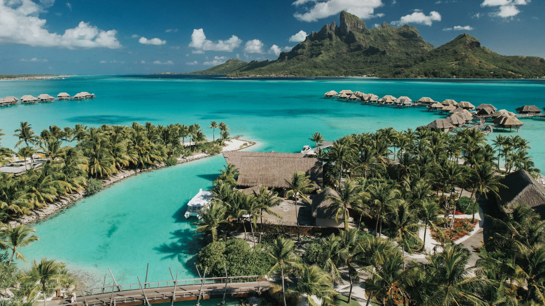 Luxury overwater villas looking at Mount Otemanu in Bora Bora