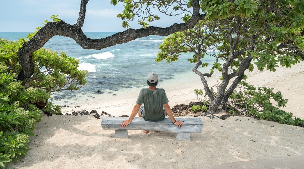 A man sitting by the beach