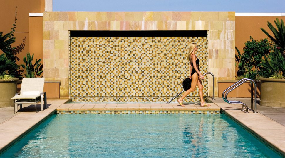 A woman walking by pool