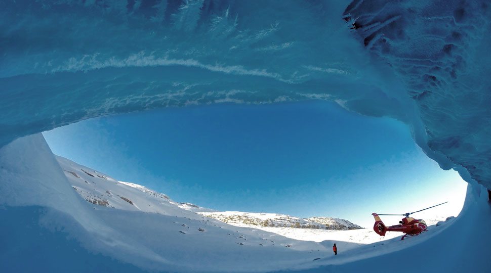 Helicopter outside of ice cave