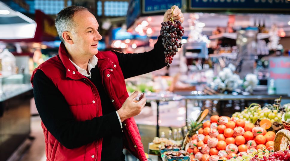 Chef Le Squer from the Four Seasons Paris shops in a market