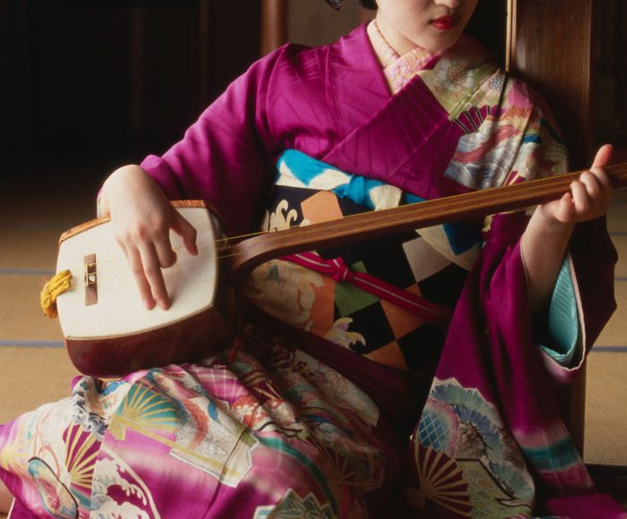 Geisha playing a shamisen