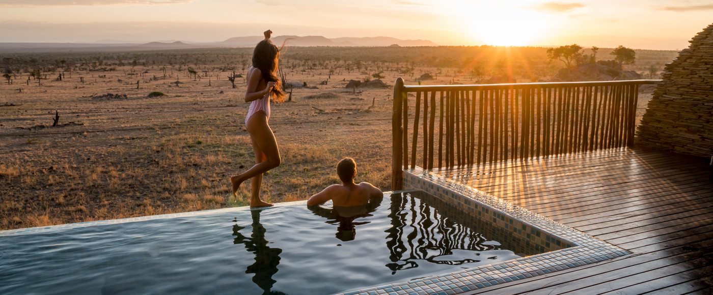 Photographer Robert Michael Poole and his partner, Marcy Yu, enjoying sunset at their private infinity pool at Four Seasons Safari Lodge Serengeti.