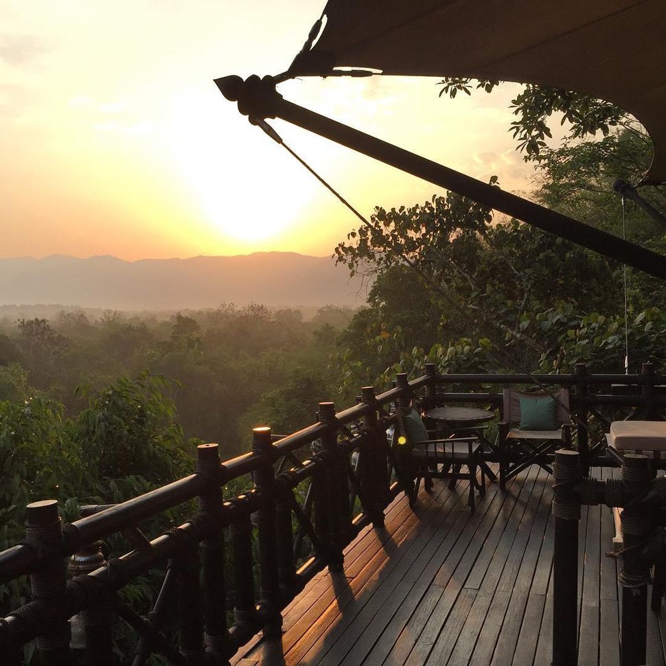 Golden Triangle balcony with view of sunset and jungle