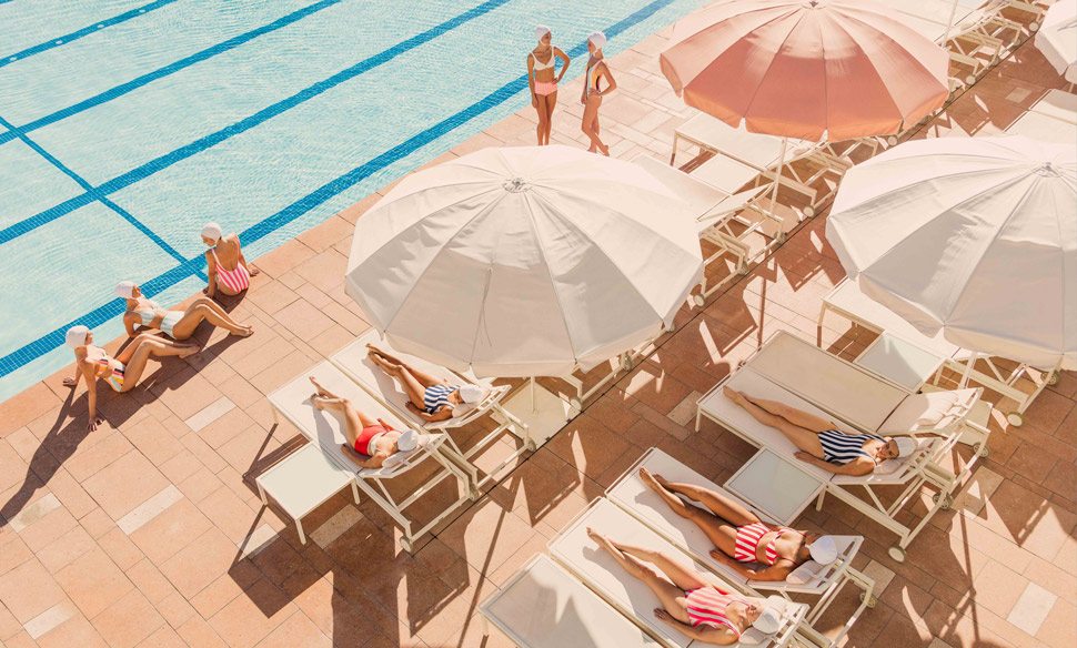 Women lounging poolside