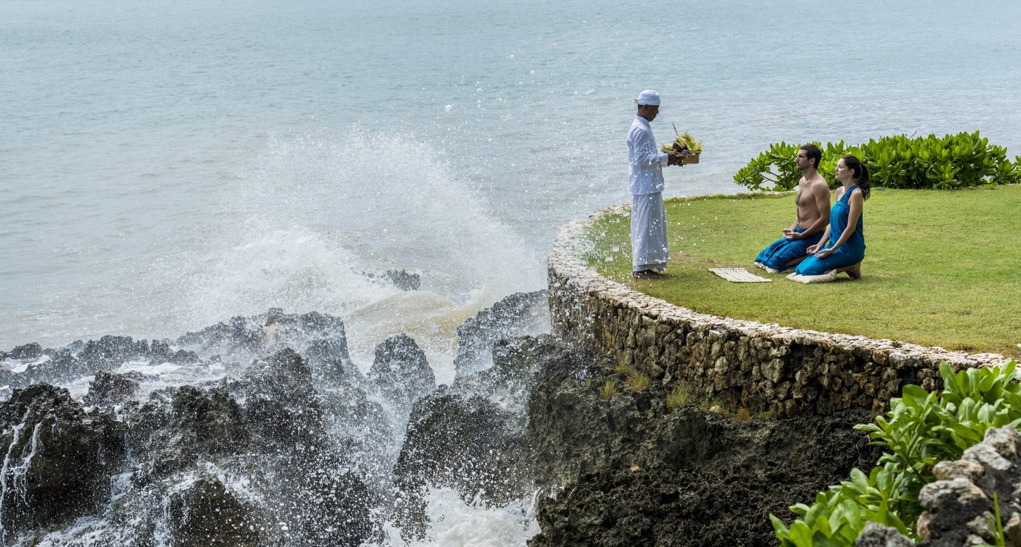 A couple takes part in a Balinese blessing