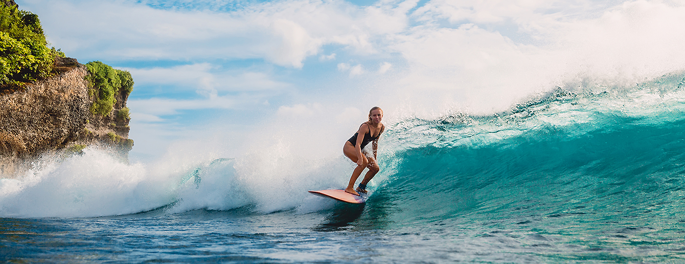 Surf Girl On Surfboard. Woman In Ocean During Surfing. Surfer And Ocean Wave