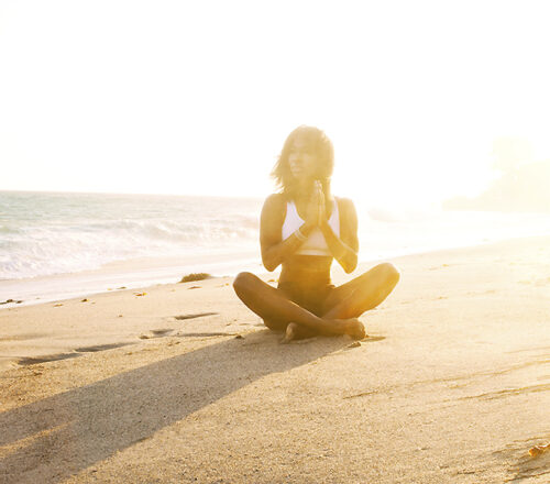 Girl Doing Yoga On Beach