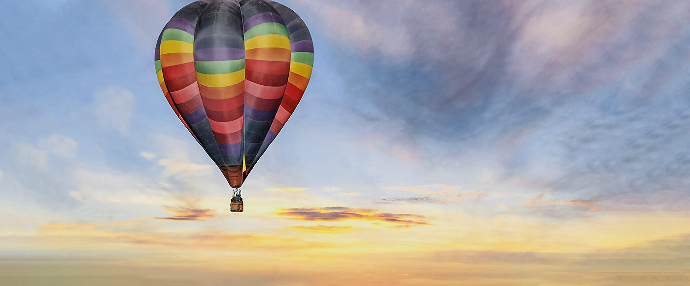 Hot Air Balloon In Colorful Sunrise Sky