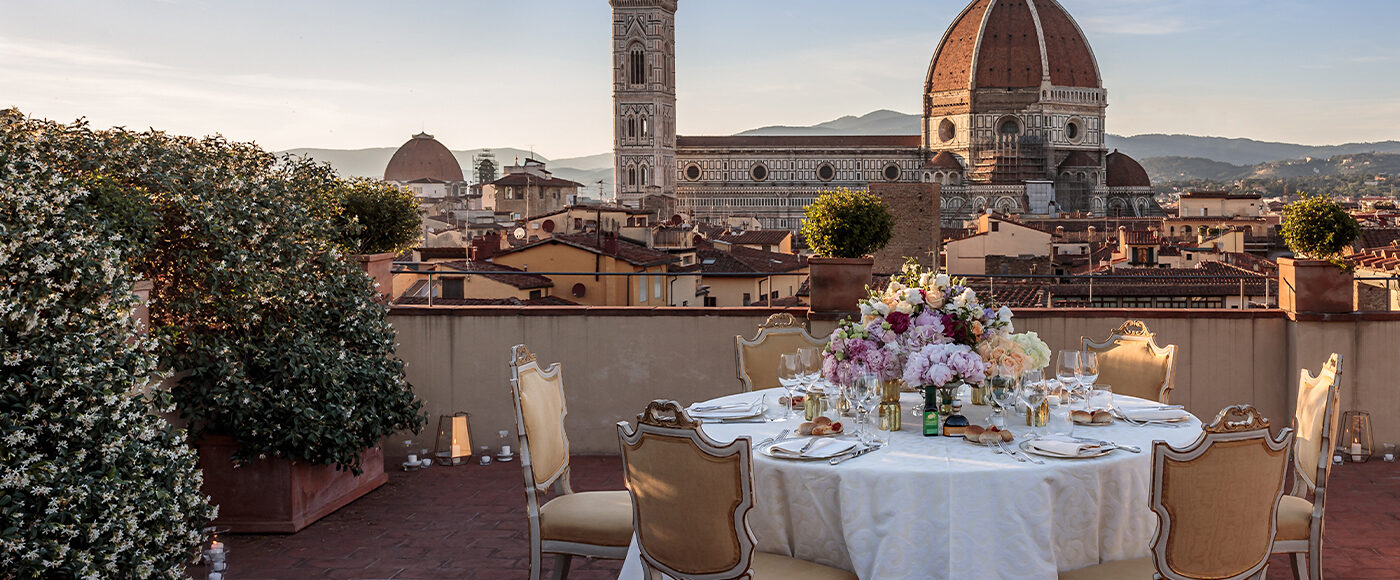 Table for six set on a terrace over looking the Duomo in Florence