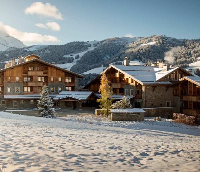 Alpine lodge surrounded by snow-covered mountains