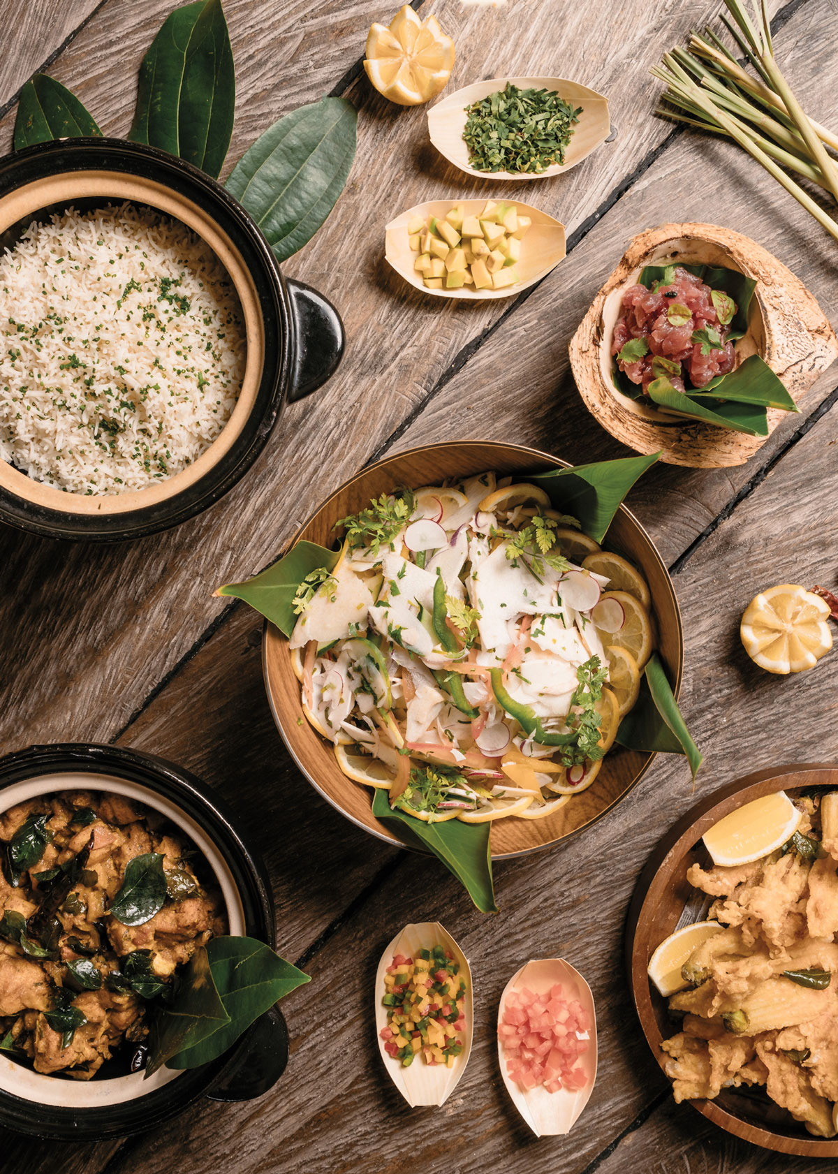 Dishes, including chicken curry and palmist salad, from the Sware Kreol dining experience at Four Seasons Resort Seychelles
