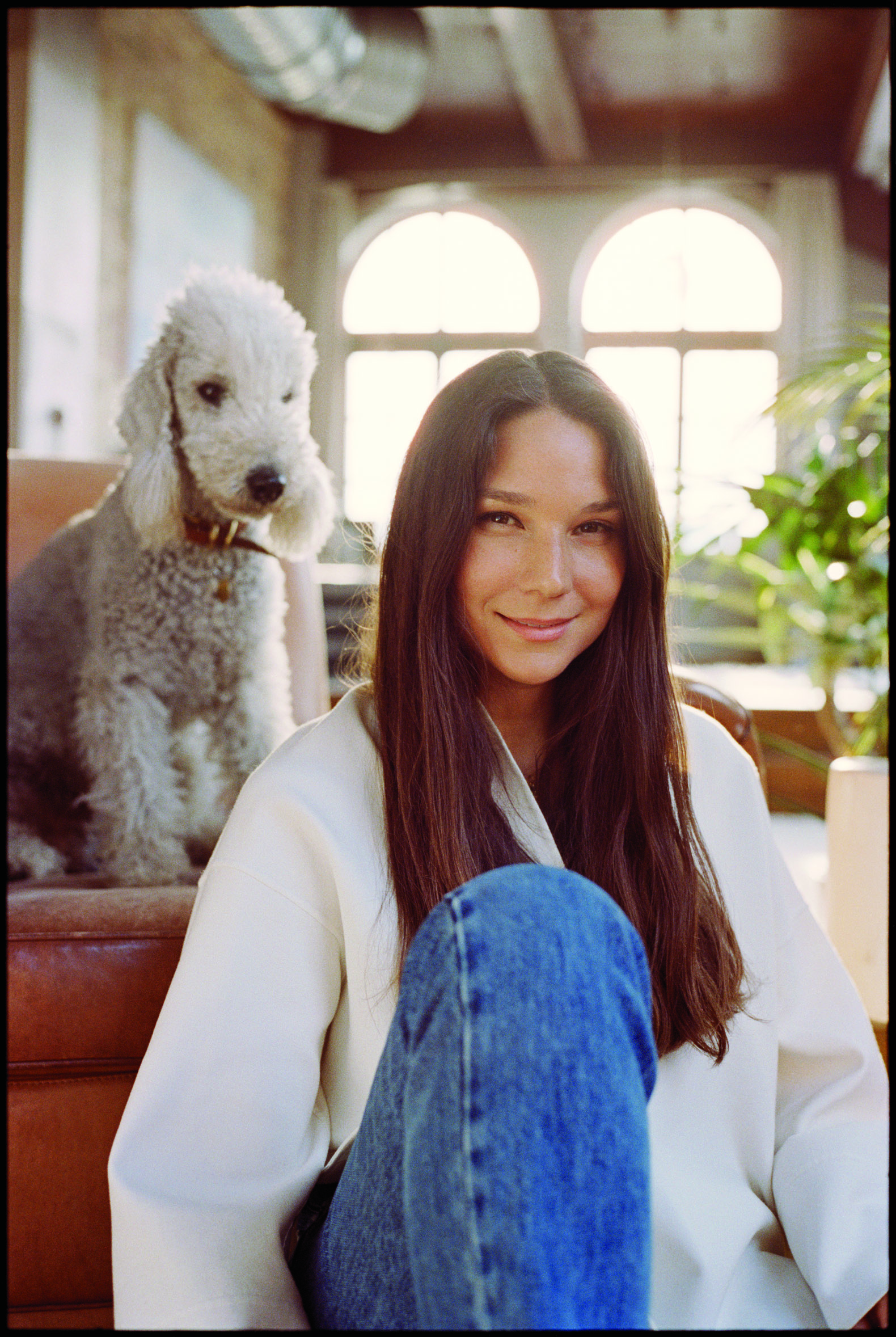 Portrait of Nanuska founder Sandra Sándor and her dog