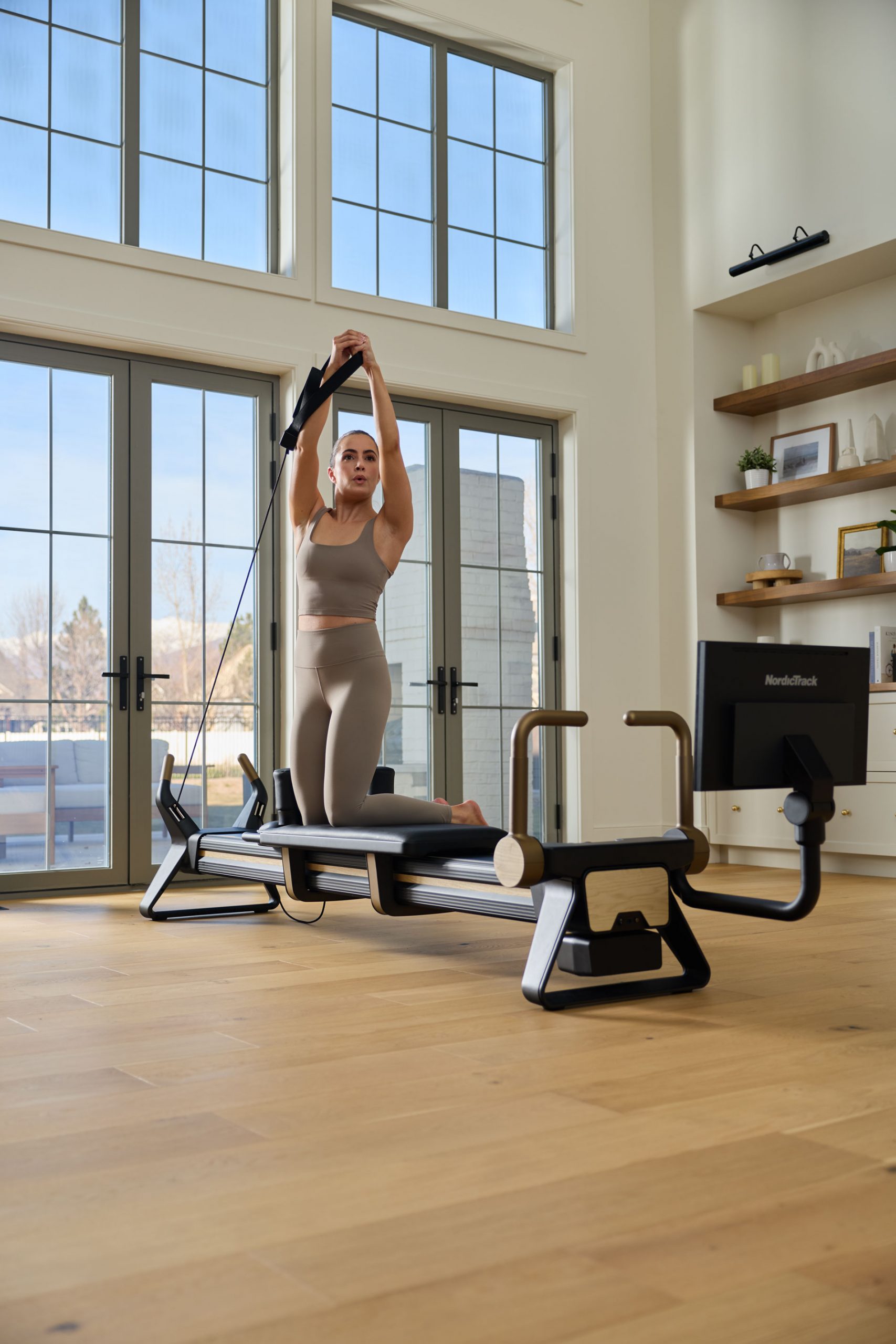 Woman doing pilates on NordicTrack Ultra 1 Reformer