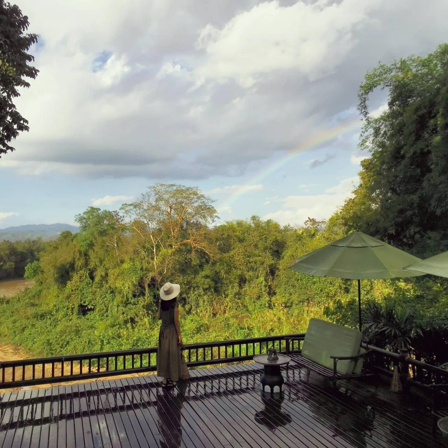 Guest enjoying a lush patio view