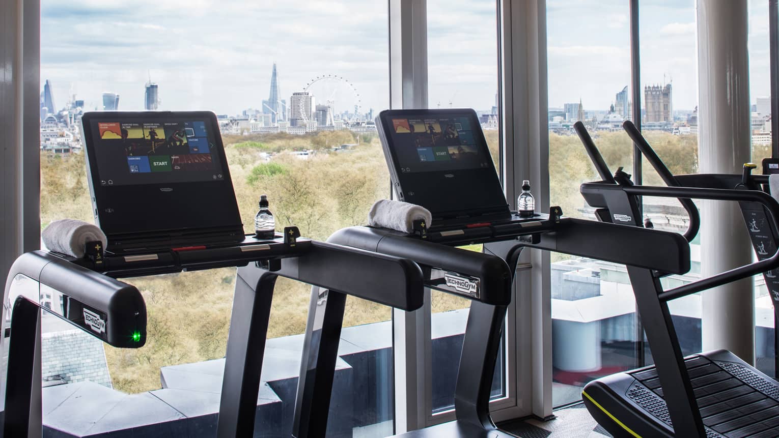 Treadmills along sunny window it Fitness Centre