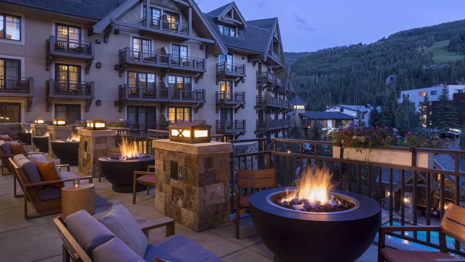 The Remedy Bar Terrace patio lounge, outdoor bonfire fireplace at night