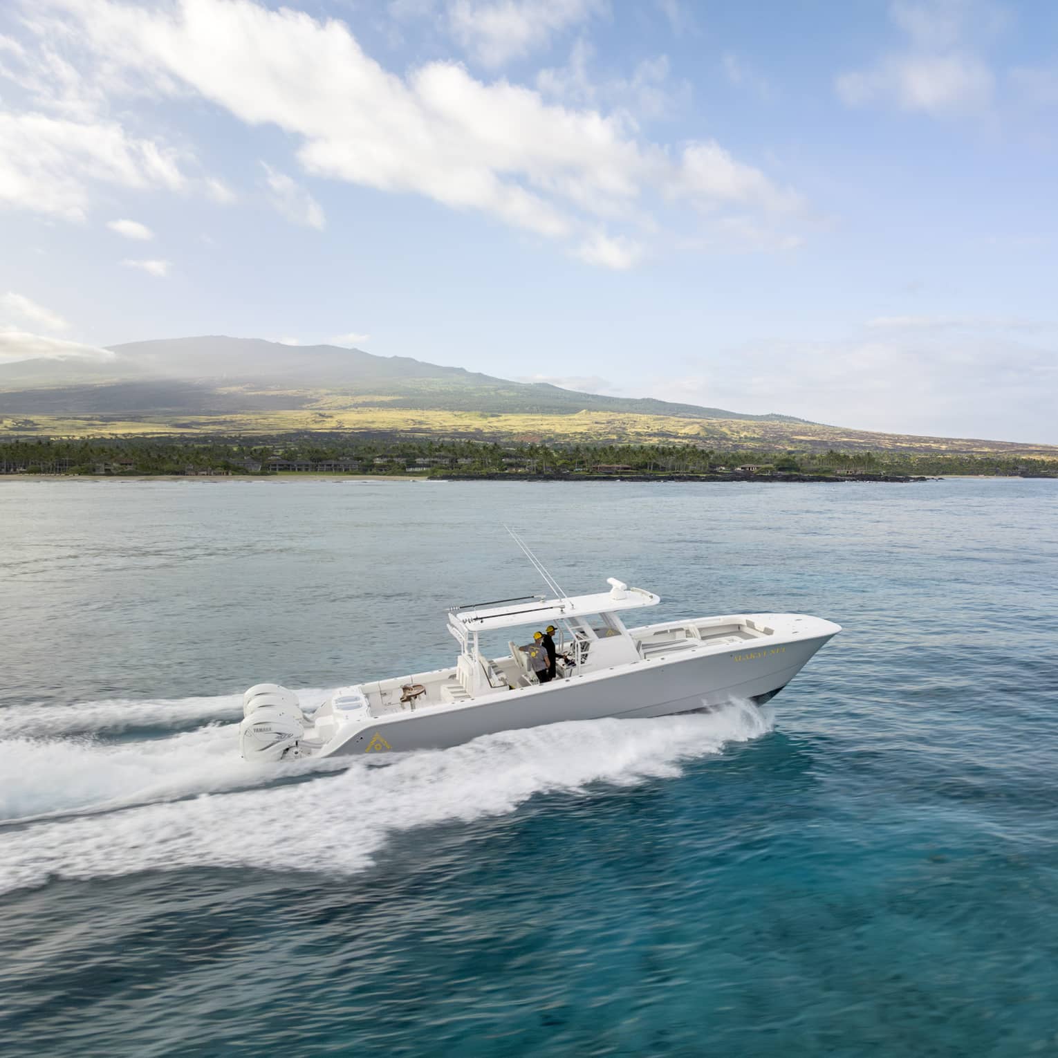 Boat on the water along Hawaii Island coast