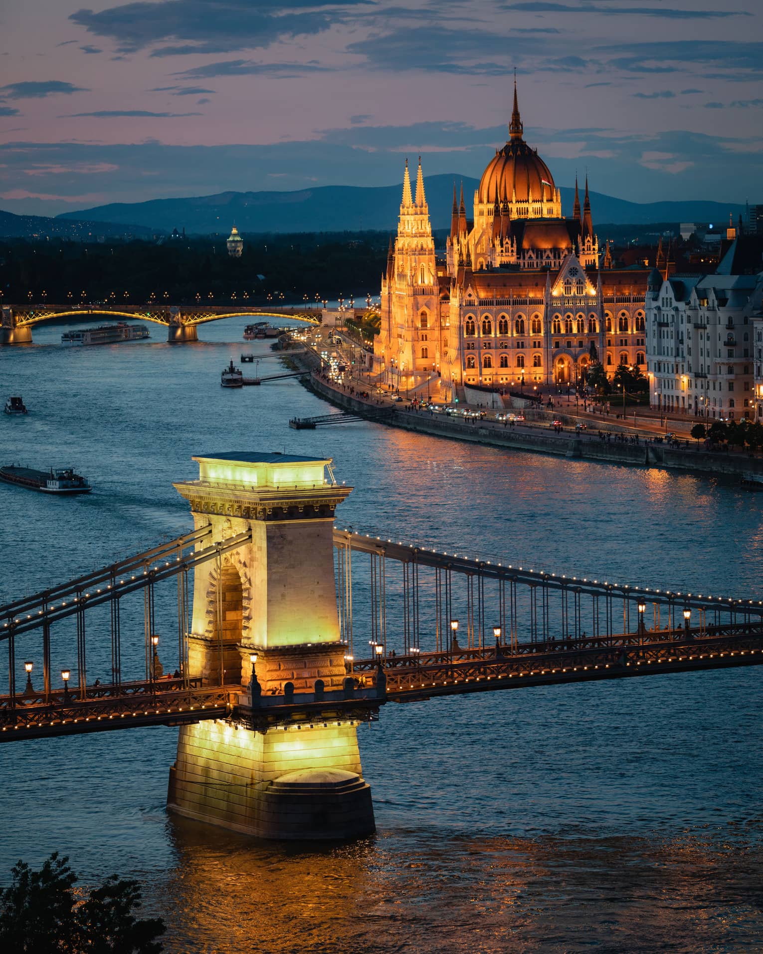 View of the Danube and buildings lit up at night 