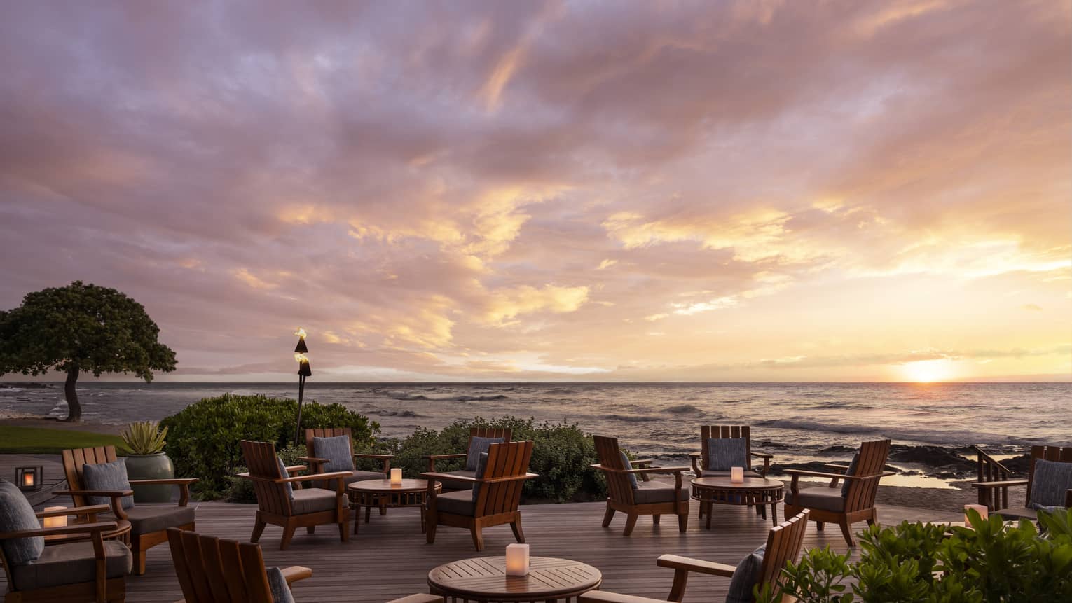 Restaurant terrace next to the ocean at sunset