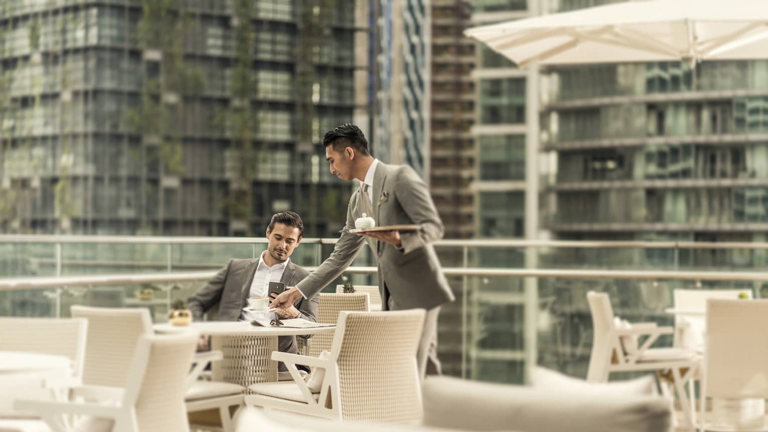 The outdoor terrace of Executive Club at Four Seasons Hotel Kuala Lumpur, with views of KLCC Park
