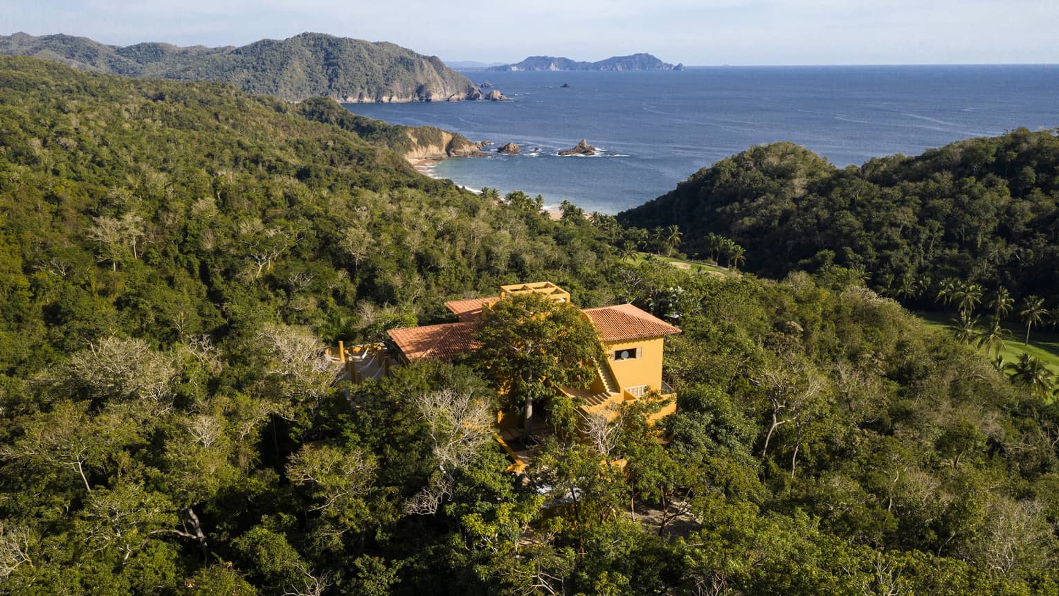 Aerial view of a private villa nestled in the jungle, close to the Tamarindo beach
