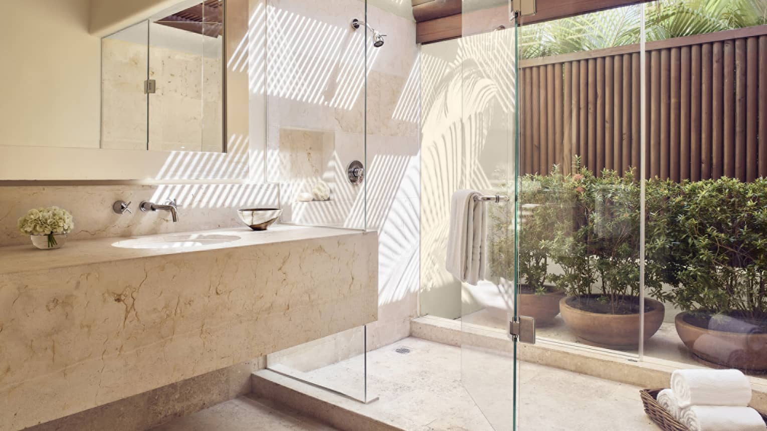 Bathroom with large glass shower, window to private terrace