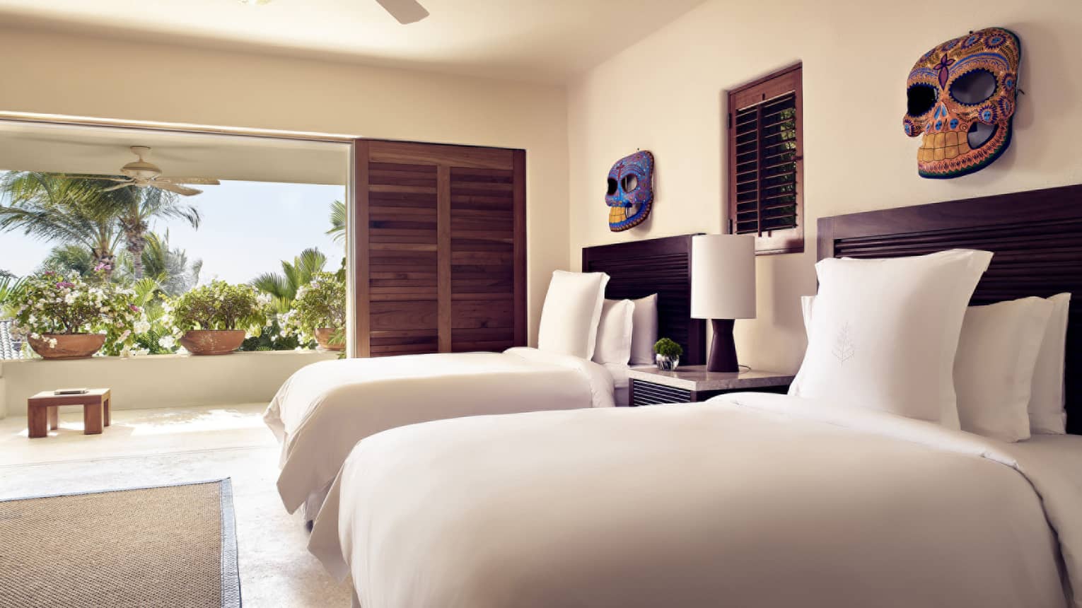 Bedroom with two queen beds and walk-out balcony