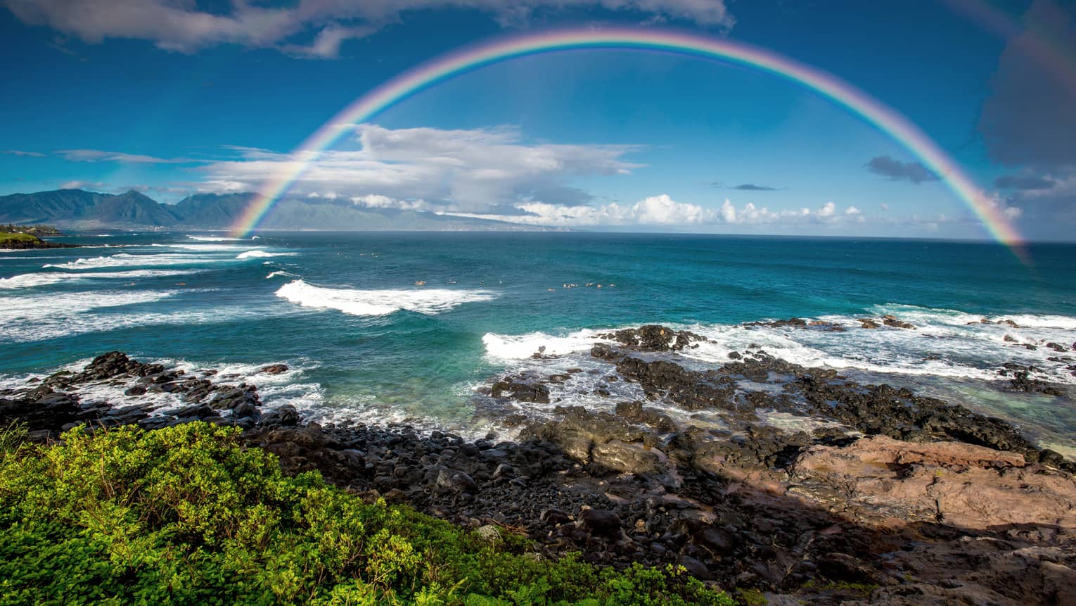 View from land of rainbow across ocean in Ho'okpia