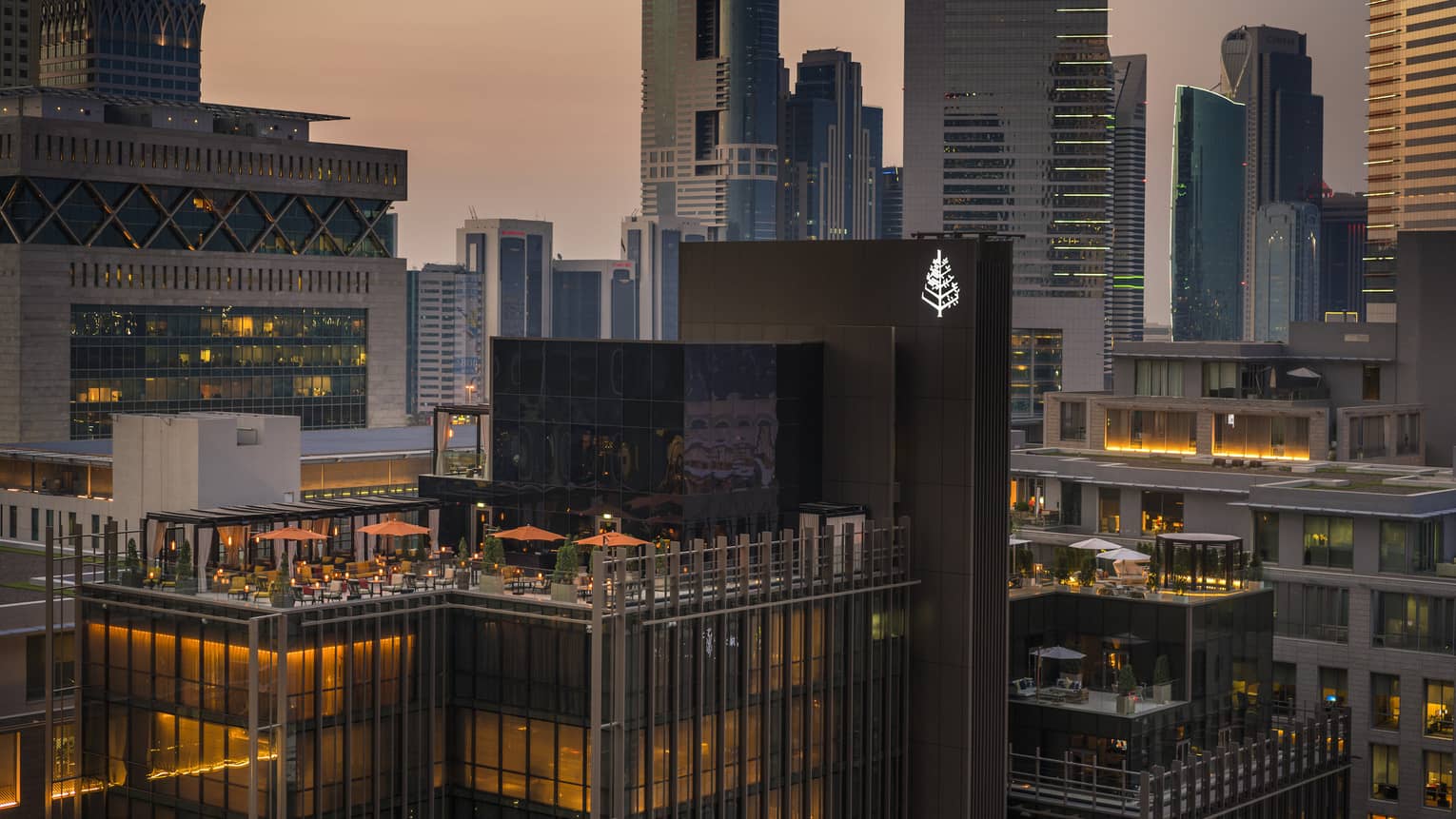 Exterior view of the rooftop of Four Seasons Hotel Dubai International Financial Centre with the skyline in the background