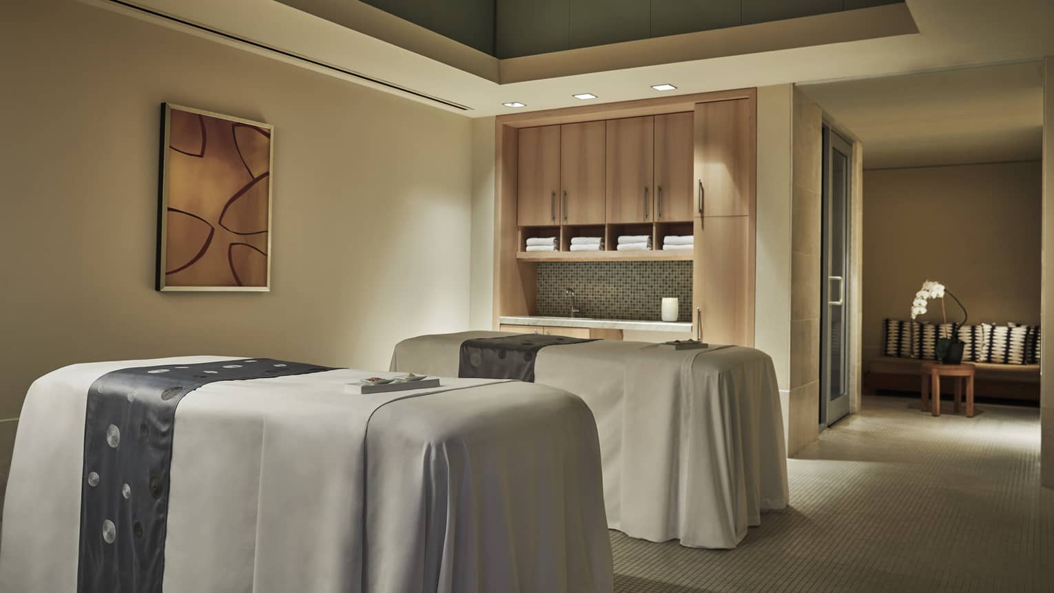 Two massage tables in spa couples treatment room