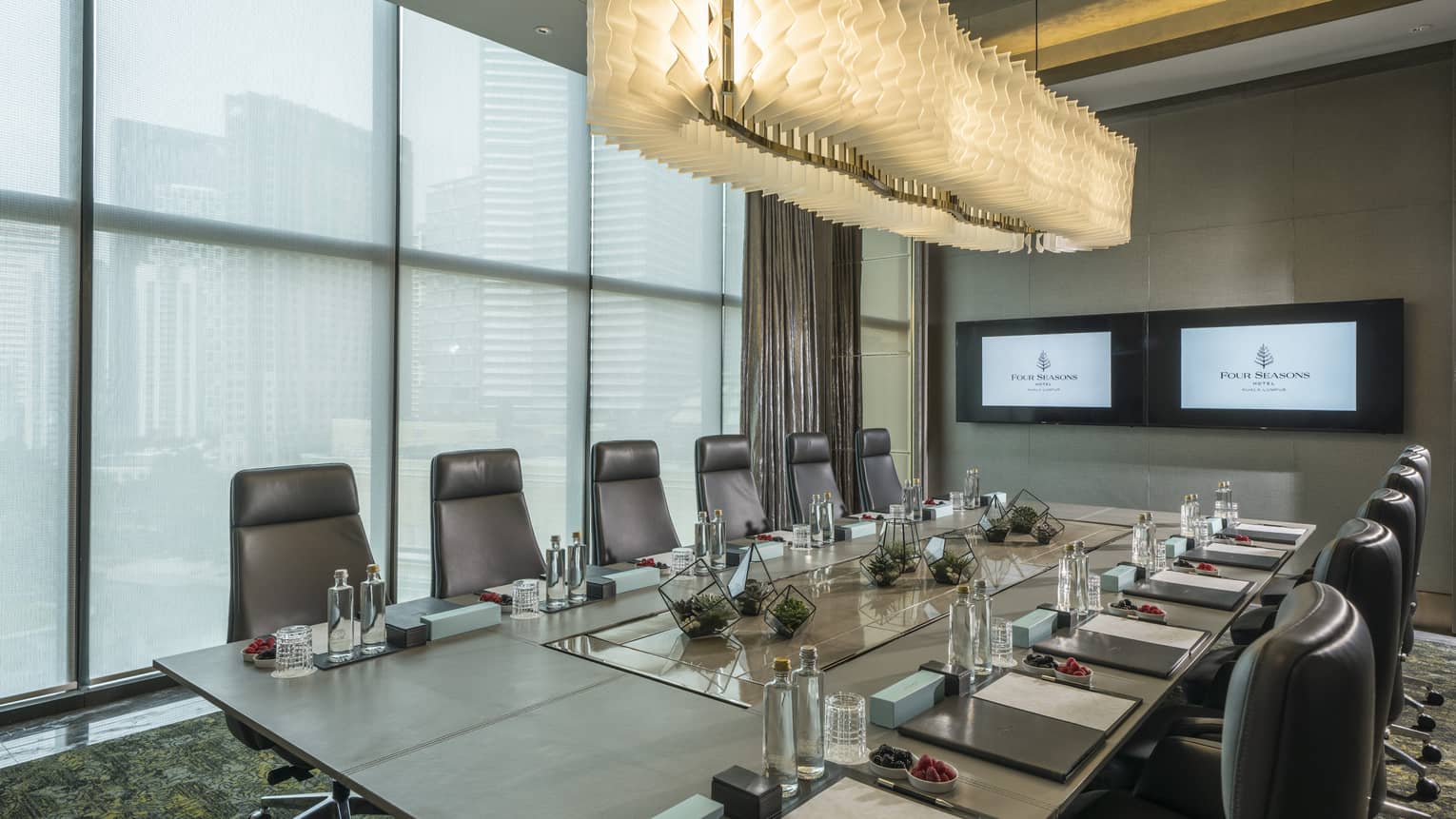 Private meeting room at Four Seasons Hotel Kuala Lumpur, featuring floor-to-ceiling windows