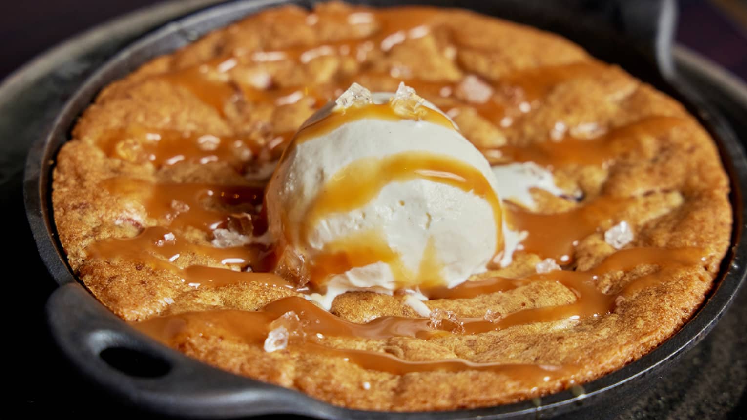 A dessert in a large pan with ice cream.