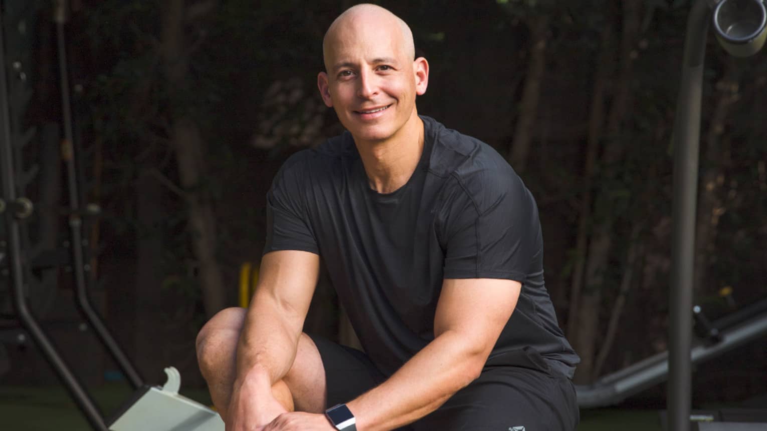 Harley Pasternak, Global Fitness Advisor, poses on a fitness machine