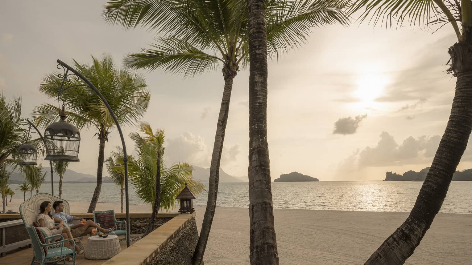 Upper Serai Sunset Lounge terrace overlooking the beach with view of palm trees