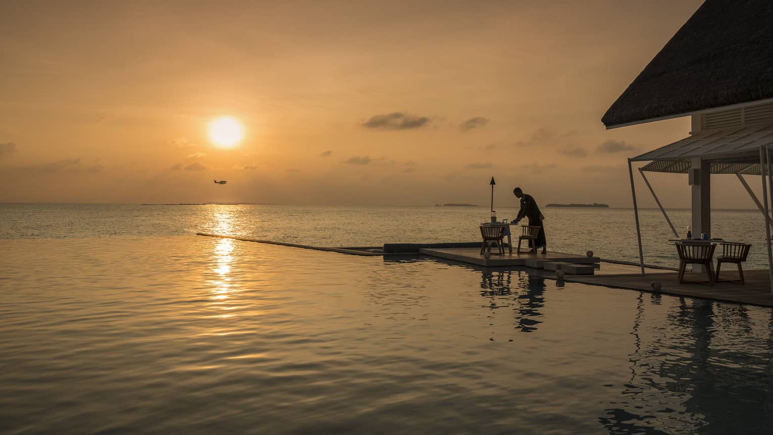 An intimate sunset dinner on a a dock at the Blu Beach Club
