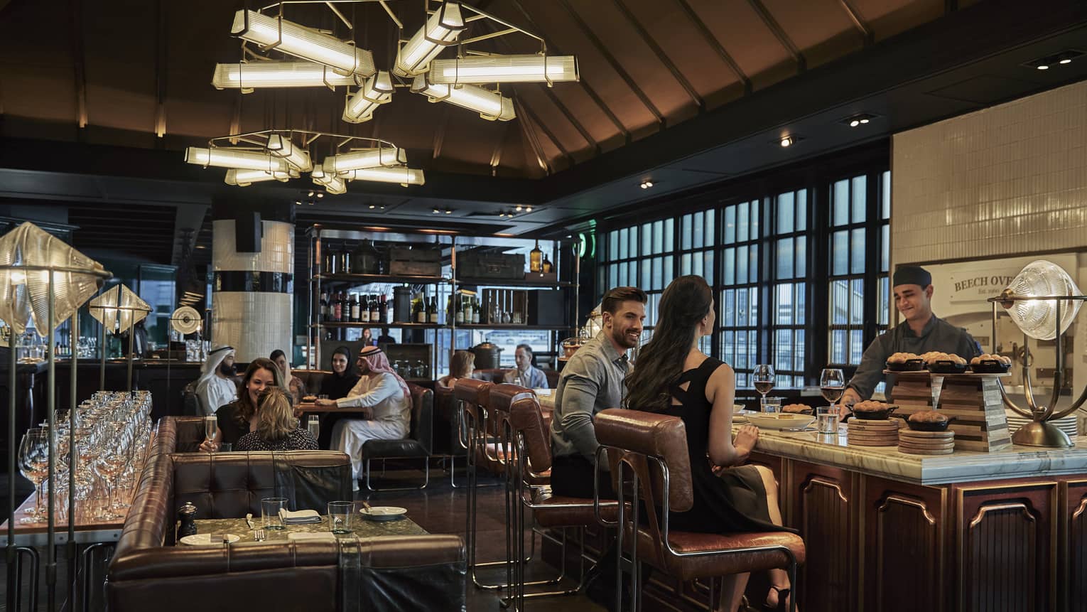 Various couples dine at Butcher & Still in the evening