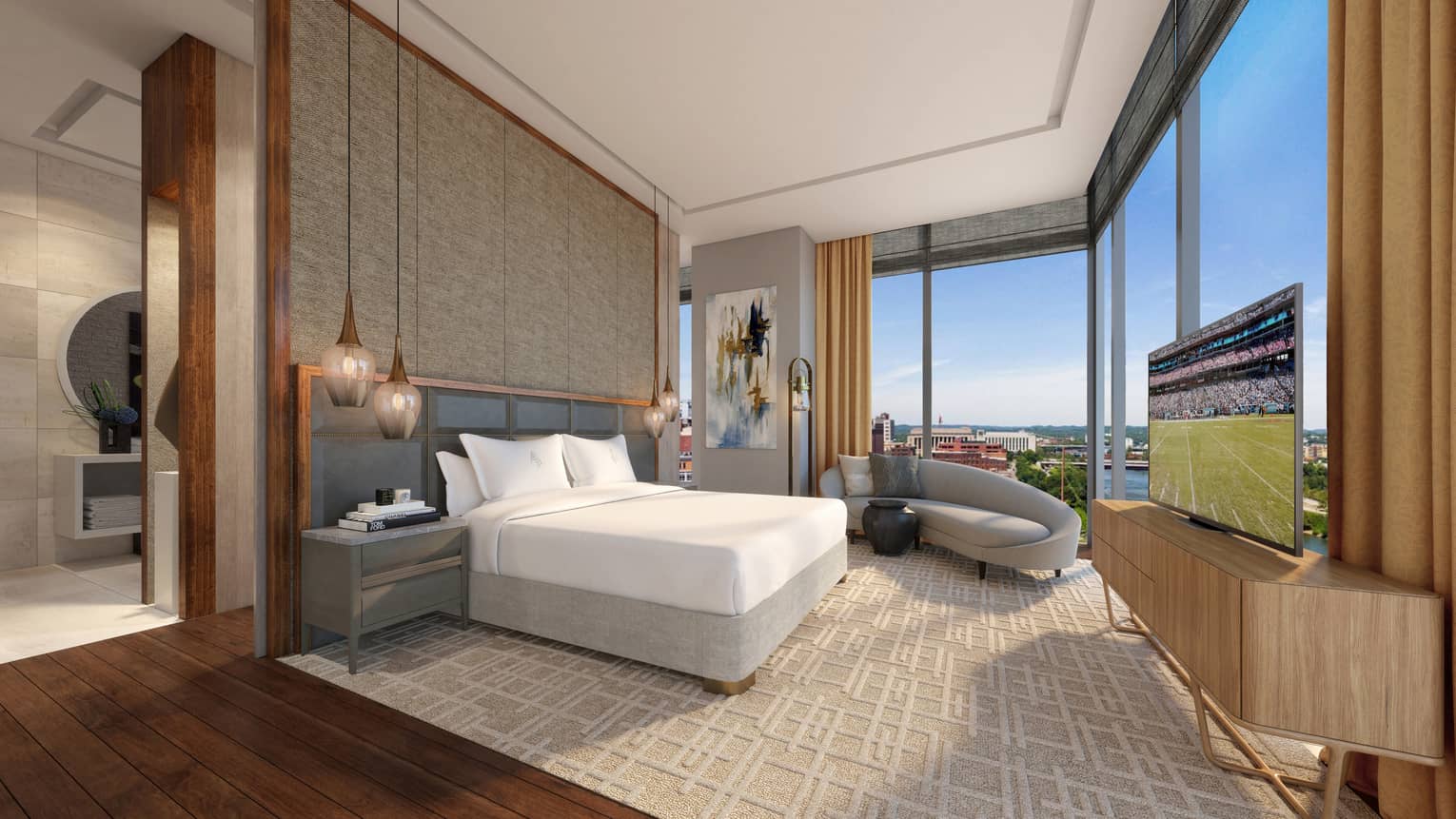 Hotel bedroom with king bed, chaise and corner windows