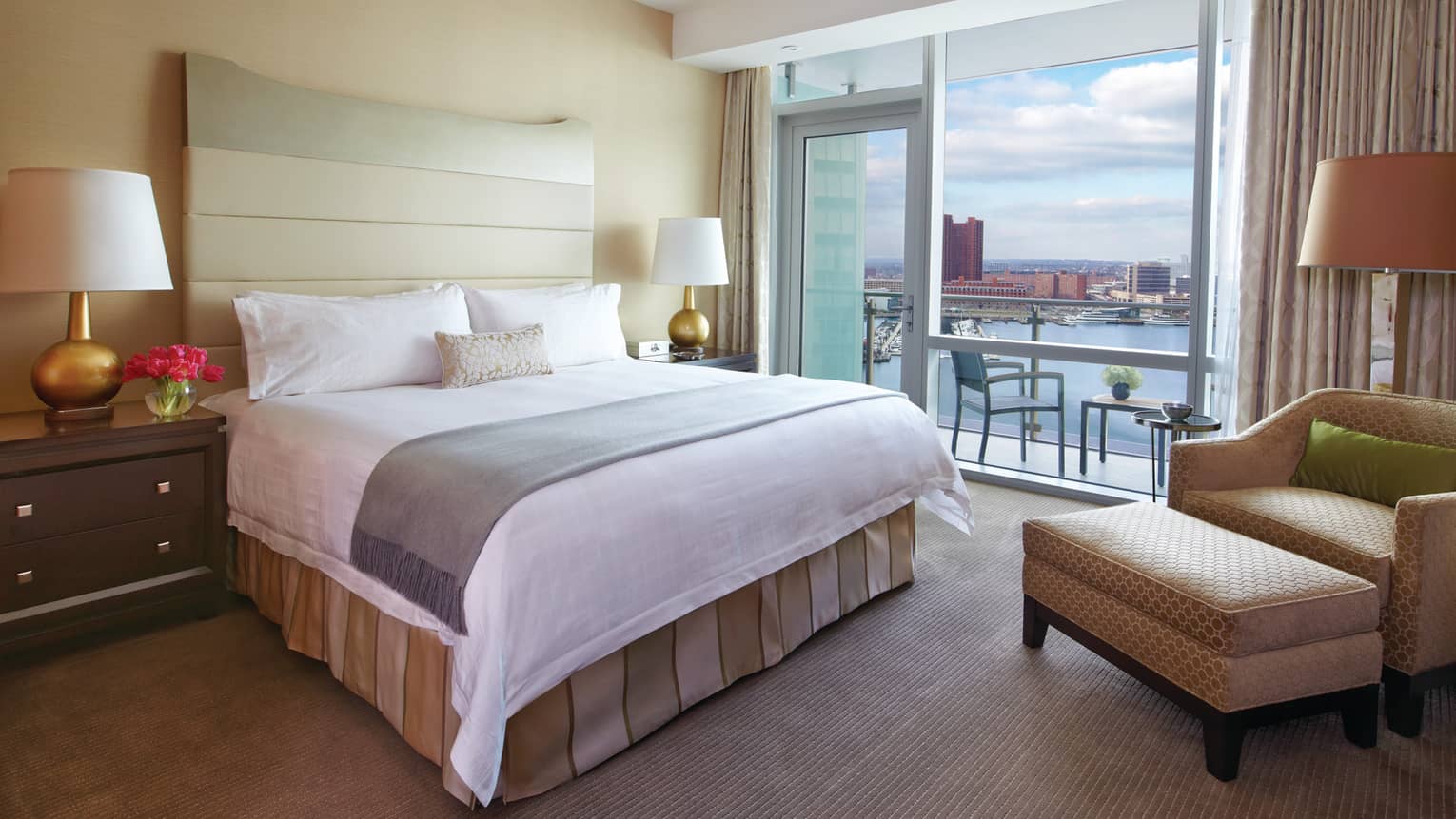 A suite with an outdoor balcony overlooking the water