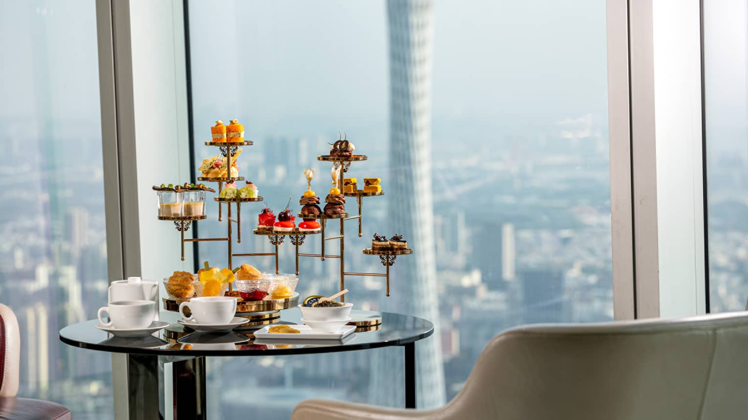 Afternoon Tea sweets tower at the Atrium with views of downtown Guangzhou