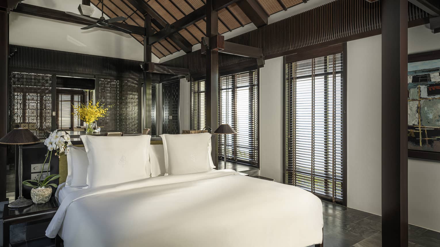 King bed in a private villa with vaulted ceiling