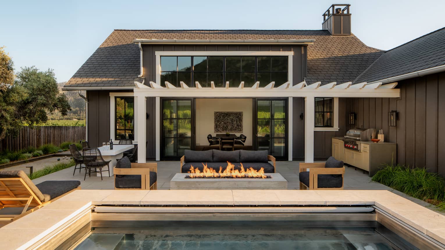 Private residence terrace with gas fire pit, pergola and pool